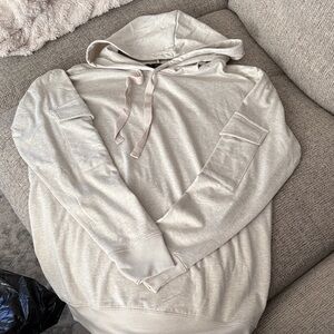 Super soft long sleeve hooded shirt. Cargo pockets on the sleeves. NWOT